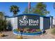 Landscaped sign for the Sun Bird Golf Resort under blue sky at 1642 E Palm Beach Dr, Chandler, AZ 85249