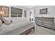 Inviting bedroom with large windows, soft lighting, and contemporary decor at 16593 W Alameda Rd, Surprise, AZ 85387