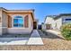 Inviting home entrance with desert landscaping and a well-maintained walkway at 16593 W Alameda Rd, Surprise, AZ 85387