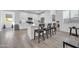 Modern kitchen featuring white cabinets, stainless steel appliances, and a center island at 16593 W Alameda Rd, Surprise, AZ 85387