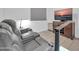 Entertainment room featuring reclining leather seating and a modern television setup at 16593 W Alameda Rd, Surprise, AZ 85387