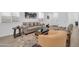 Bright living room featuring a comfortable sofa, neutral tones, and contemporary decor at 16593 W Alameda Rd, Surprise, AZ 85387