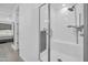 Modern bathroom features a spacious walk-in shower with a built-in bench and dual shower heads at 16593 W Alameda Rd, Surprise, AZ 85387