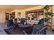 Covered back patio provides cozy seating with mature landscaping and natural lighting at 16648 W Adams St, Goodyear, AZ 85338