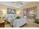 Bright bedroom features neutral walls, carpet and a large window at 16648 W Adams St, Goodyear, AZ 85338
