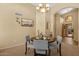 Elegant dining space with comfortable seating, and arched entrance at 16648 W Adams St, Goodyear, AZ 85338