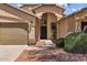 Attractive single-story home with a two-car garage, desert landscaping, and welcoming front entrance at 16648 W Adams St, Goodyear, AZ 85338