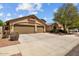 Charming single-Gathering home with a 3-car garage, mature landscaping, and inviting curb appeal at 16648 W Adams St, Goodyear, AZ 85338