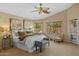 Bright main bedroom features neutral walls, carpet and a large window with backyard views at 16648 W Adams St, Goodyear, AZ 85338