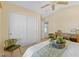 Bright main bedroom with vaulted ceiling, dual closets, and elegant decor and seating at 16648 W Adams St, Goodyear, AZ 85338