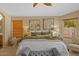 Bright main bedroom features neutral walls, carpet and a large window at 16648 W Adams St, Goodyear, AZ 85338
