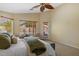 Bright main bedroom features neutral walls, carpet and a door to the backyard at 16648 W Adams St, Goodyear, AZ 85338