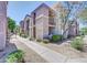 Beautiful condo building with stucco walls, covered balconies, and desert landscaping at 17017 N 12Th St # 2117, Phoenix, AZ 85022