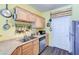 Bright eat-in kitchen features stainless steel appliances, wood cabinets, and a neutral countertop at 17017 N 12Th St # 2117, Phoenix, AZ 85022