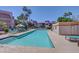 A refreshing community pool surrounded by lounge chairs, palm trees, and well-maintained landscaping at 17017 N 12Th St # 2117, Phoenix, AZ 85022