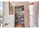 Outdoor storage featuring water heater, shelving, and ample space for personal items on balcony at 17017 N 12Th St # 2117, Phoenix, AZ 85022
