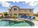 Exterior showcases a pool, putting green, lounge chairs and mature desert landscaping at 18330 W Woodrow Ln, Surprise, AZ 85388