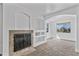 Bonus room features carpet, recessed lighting, fireplace, built-in shelving, and dual windows at 18330 W Woodrow Ln, Surprise, AZ 85388