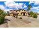 Inviting two-story home featuring desert landscaping, a spacious driveway, and a convenient two-car garage at 18330 W Woodrow Ln, Surprise, AZ 85388
