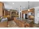Gourmet kitchen featuring granite countertops, custom cabinetry, and stainless steel appliances at 18330 W Woodrow Ln, Surprise, AZ 85388