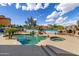 Beautiful pool and spa with stone features in a well-manicured backyard, perfect for relaxing and entertaining at 18330 W Woodrow Ln, Surprise, AZ 85388