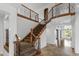Elegant staircase featuring wood banisters and carpeted steps, adding a touch of sophistication at 18330 W Woodrow Ln, Surprise, AZ 85388