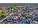 Breathtaking aerial shot featuring a well-kept neighborhood with golf course and mountain views at 19472 N Marble Canyon Ct, Surprise, AZ 85374
