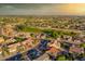 Wide aerial panorama showcasing a golf course community with various housing styles and tree-lined streets at 19472 N Marble Canyon Ct, Surprise, AZ 85374