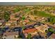 Expansive aerial perspective of the community, showcasing landscaped yards and proximity to golf course at 19472 N Marble Canyon Ct, Surprise, AZ 85374
