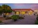 Inviting outdoor patio with seating, perfect for enjoying the serene backyard and desert landscape at 19472 N Marble Canyon Ct, Surprise, AZ 85374