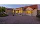 Comfortable outdoor patio with desert landscaping that's perfect for relaxation and entertaining at 19472 N Marble Canyon Ct, Surprise, AZ 85374