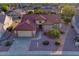Charming single-story home with a well-maintained front yard and a spacious two-car garage at 19472 N Marble Canyon Ct, Surprise, AZ 85374