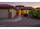 Charming single-story home boasts a well-maintained desert landscape and inviting front entrance at 19472 N Marble Canyon Ct, Surprise, AZ 85374
