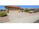Lovely single-story home boasting a two-car garage and low-maintenance landscaping for easy care and curb appeal at 19472 N Marble Canyon Ct, Surprise, AZ 85374