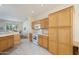 Cozy kitchen showcasing wooden cabinets, modern appliances, and tile floors at 19472 N Marble Canyon Ct, Surprise, AZ 85374