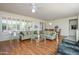 Bright, spacious living room featuring hardwood floors, comfortable seating, and lots of natural light at 19472 N Marble Canyon Ct, Surprise, AZ 85374