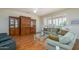 Cozy living room featuring plush seating, hardwood floors, ample natural light, and stylish decor at 19472 N Marble Canyon Ct, Surprise, AZ 85374