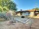 Large backyard including a patio area, firepit, desert landscaping, and mature shade trees, providing a relaxing outdoor space at 19604 N 13Th Ave, Phoenix, AZ 85027