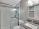 Bright bathroom with a glass-enclosed shower and a modern sink at 19604 N 13Th Ave, Phoenix, AZ 85027