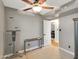 Bedroom with neutral walls, ceiling fan, and access to other rooms at 19604 N 13Th Ave, Phoenix, AZ 85027