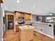 Kitchen with stainless appliances, granite countertops and an adjacent seating area at 19604 N 13Th Ave, Phoenix, AZ 85027