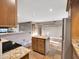 Open-concept kitchen featuring an island with granite countertops at 19604 N 13Th Ave, Phoenix, AZ 85027