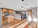 Modern kitchen with stainless steel appliances and seamless transition to the living room at 19604 N 13Th Ave, Phoenix, AZ 85027
