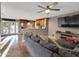 Open concept living room and kitchen with large couch and backyard access at 19604 N 13Th Ave, Phoenix, AZ 85027