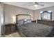 Comfortable bedroom with a decorative headboard, matching nightstands, and dresser at 19604 N 13Th Ave, Phoenix, AZ 85027