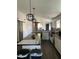 Well-lit kitchen featuring a spacious island, modern appliances, and a farmhouse sink at 2249 E Pinto Dr, Gilbert, AZ 85296
