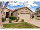 Charming single-Gathering home featuring a beige exterior, desert landscaping and a two-car garage at 23813 S Pleasant Way, Sun Lakes, AZ 85248