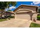 Charming single-Gathering home featuring a beige exterior, desert landscaping and a two-car garage at 23813 S Pleasant Way, Sun Lakes, AZ 85248
