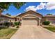 Charming single-Gathering home featuring a beige exterior, desert landscaping and a two-car garage at 23813 S Pleasant Way, Sun Lakes, AZ 85248