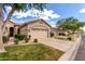 Charming single-Gathering home featuring a beige exterior, desert landscaping and a two-car garage at 23813 S Pleasant Way, Sun Lakes, AZ 85248